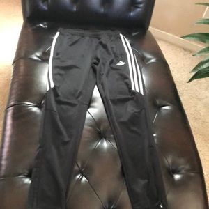 Boys Adidas skinny leg track pants.